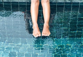 Feet in Swimming Pool Water